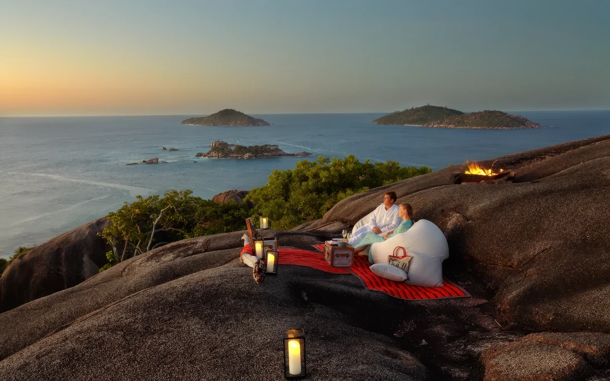 Private sunset cocktails on granite rocks overlooking the Seychelles islands