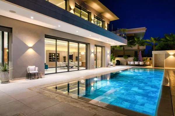 Villa Jordana illuminated pool terrace at night